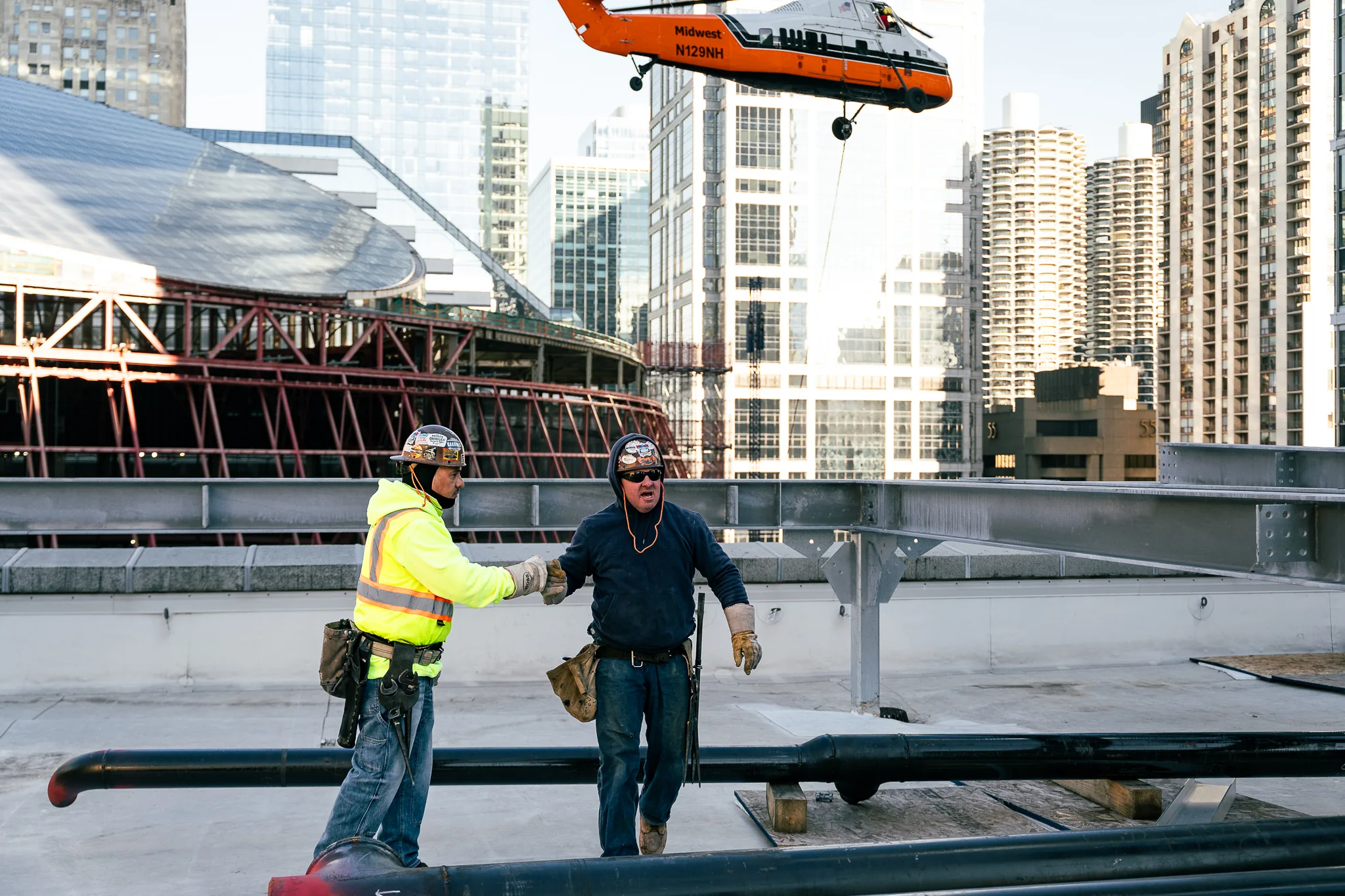 Chicago rooftop steel lift with coordinated crane support