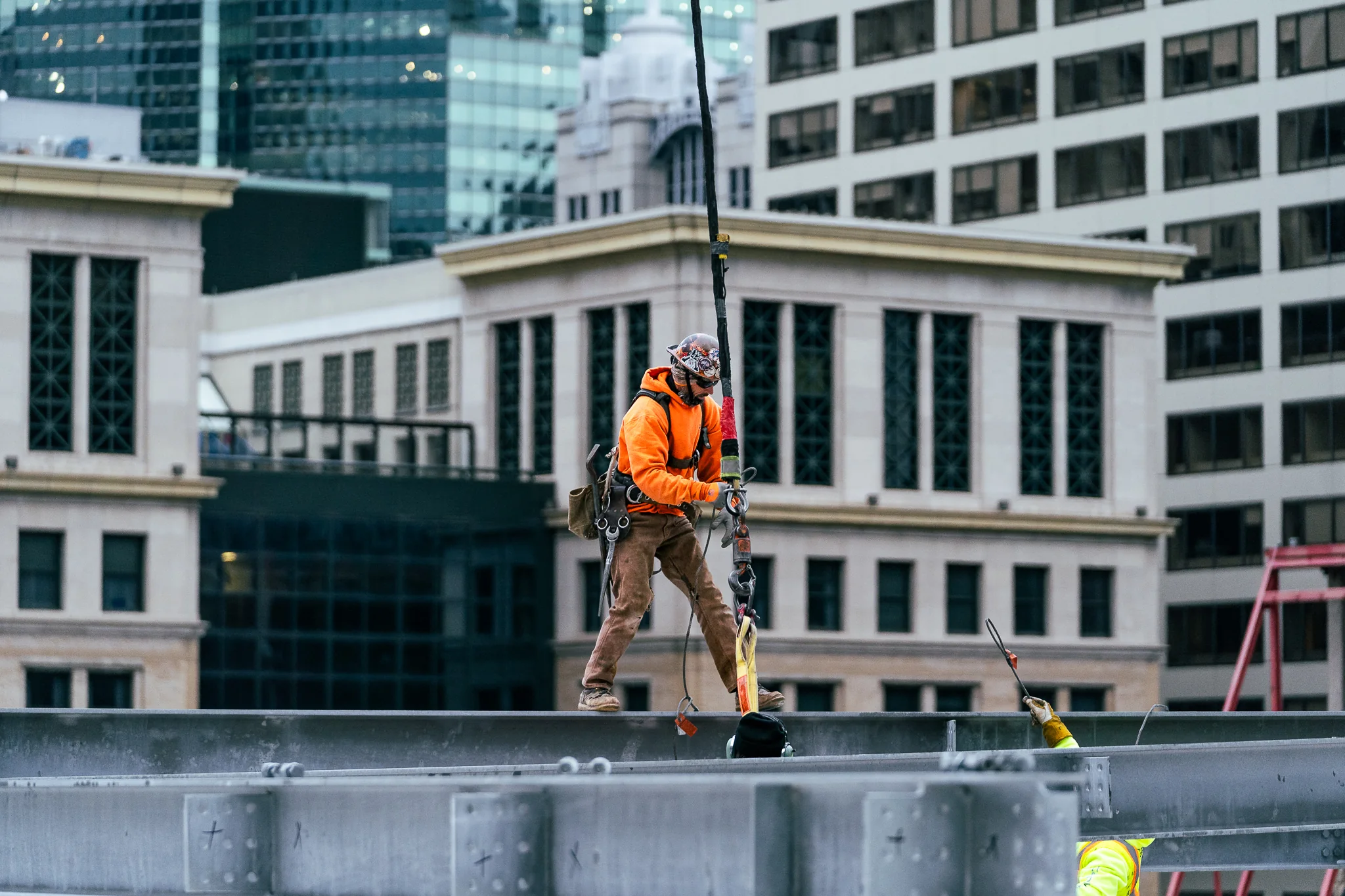 DePasquale Steel ironworker rigging structural steel on a Chicago job site
