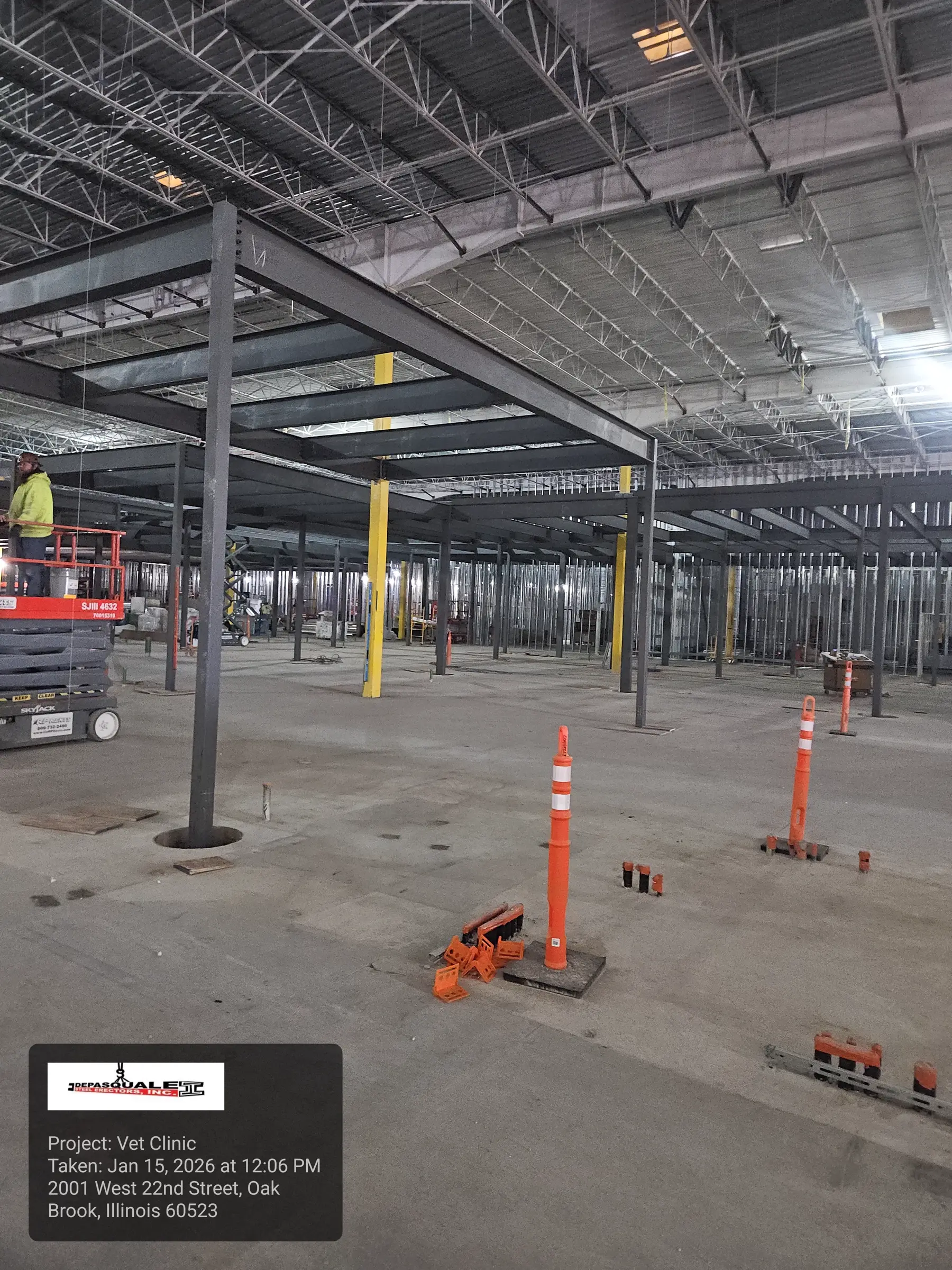Large structural steel frame under active erection